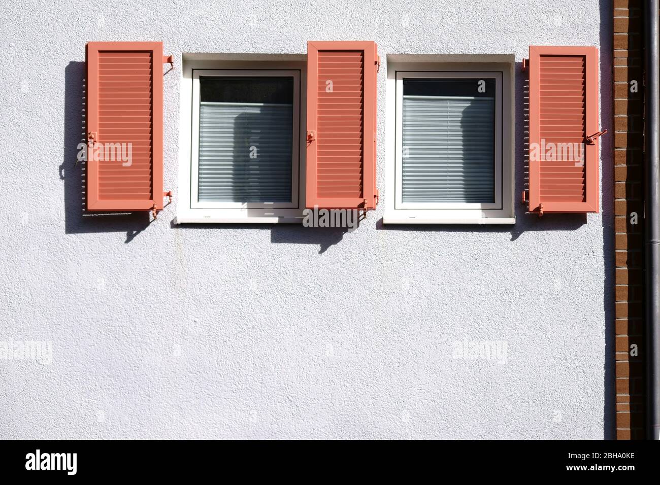 An opened new wooden shutter at a residential house. Stock Photo