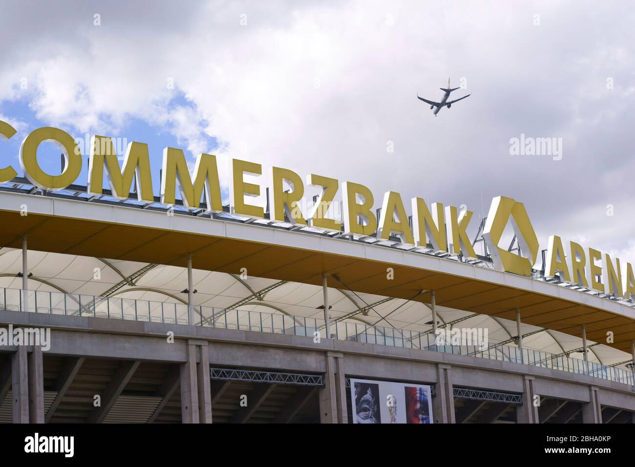 Frankfurt, Germany, A plane flies over the stadium roof and the logo of the Commerzbank Arena, the home of the football club Eintracht Frankfurt Stock Photo
