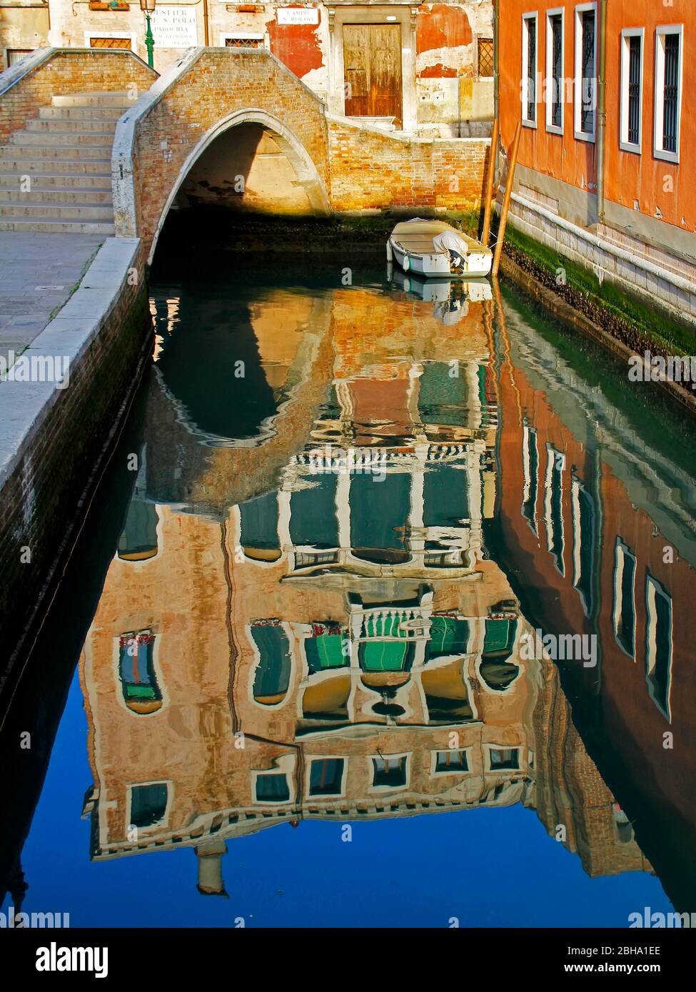 View on reflection, Venetian canal, Italy Stock Photo - Alamy