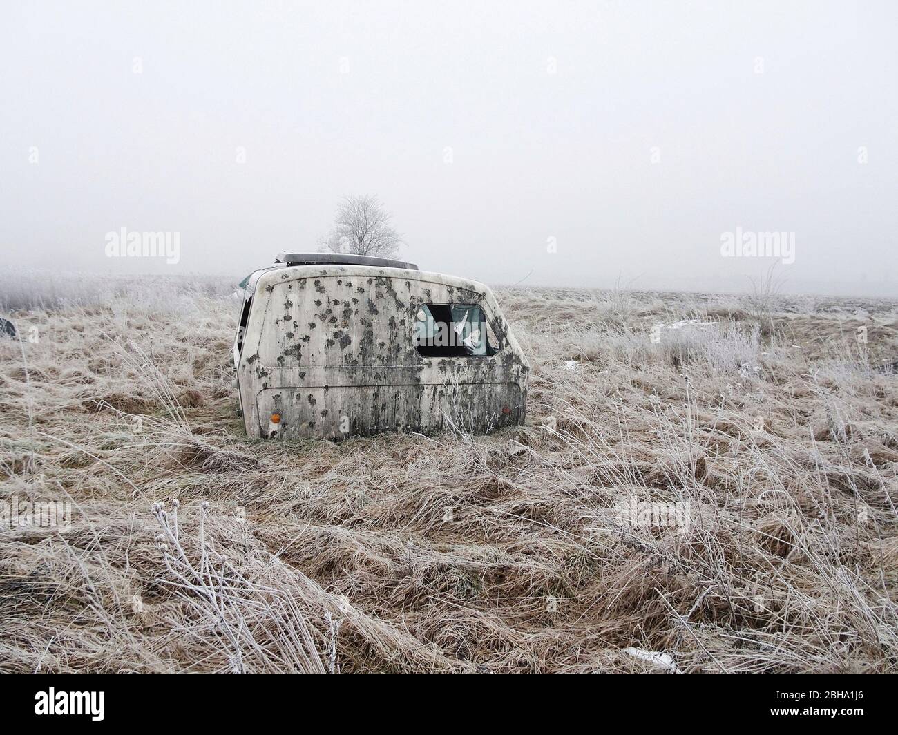 Abandoned old trailer in wintery landscape Stock Photo