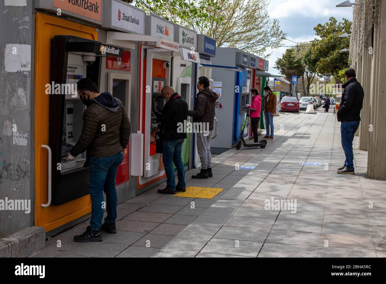 Istanbul, Turkey. 22nd Apr, 2020. People withdrawing money from ATMs from Bakirkoy square before four days curfew during coronavirus days. Bakirkoy is a neighbourhood, municipality and crowded district on the European side of Istanbul. Turkey began enforcing a four-day curfew in 31 provinces as of midnight April 22 to prevent the spread of the novel coronavirus. As of April 22 Turkey's coronavirus death toll rises to 2,376 as cases top 98,000. Credit: Tolga Ildun/ZUMA Wire/Alamy Live News Stock Photo