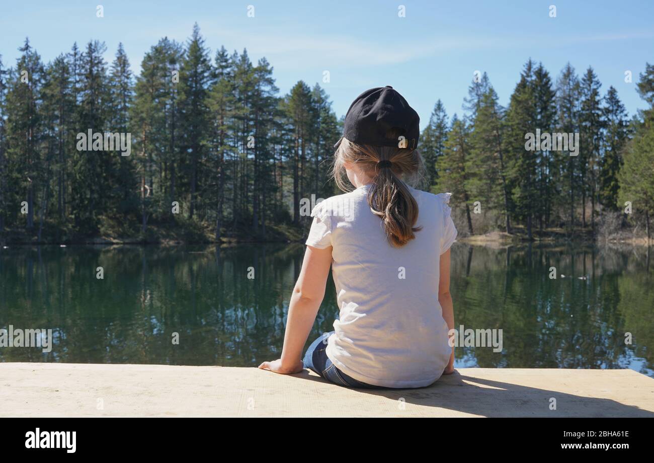 Girl sitting alone back nature hi-res stock photography and images - Alamy