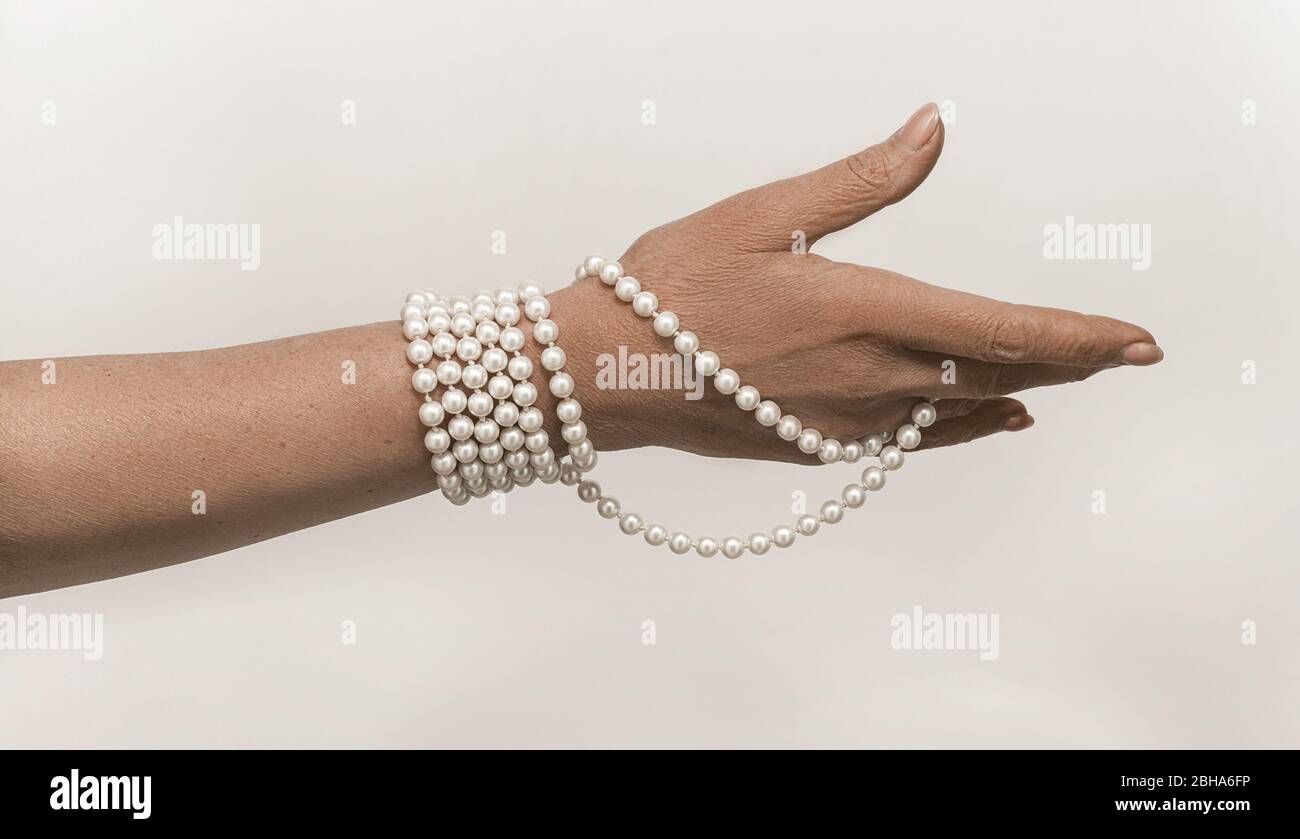 Beautiful shot of old woman hand on white background for concept design. Isolated old female portrait. Human life concept. White background Stock Photo