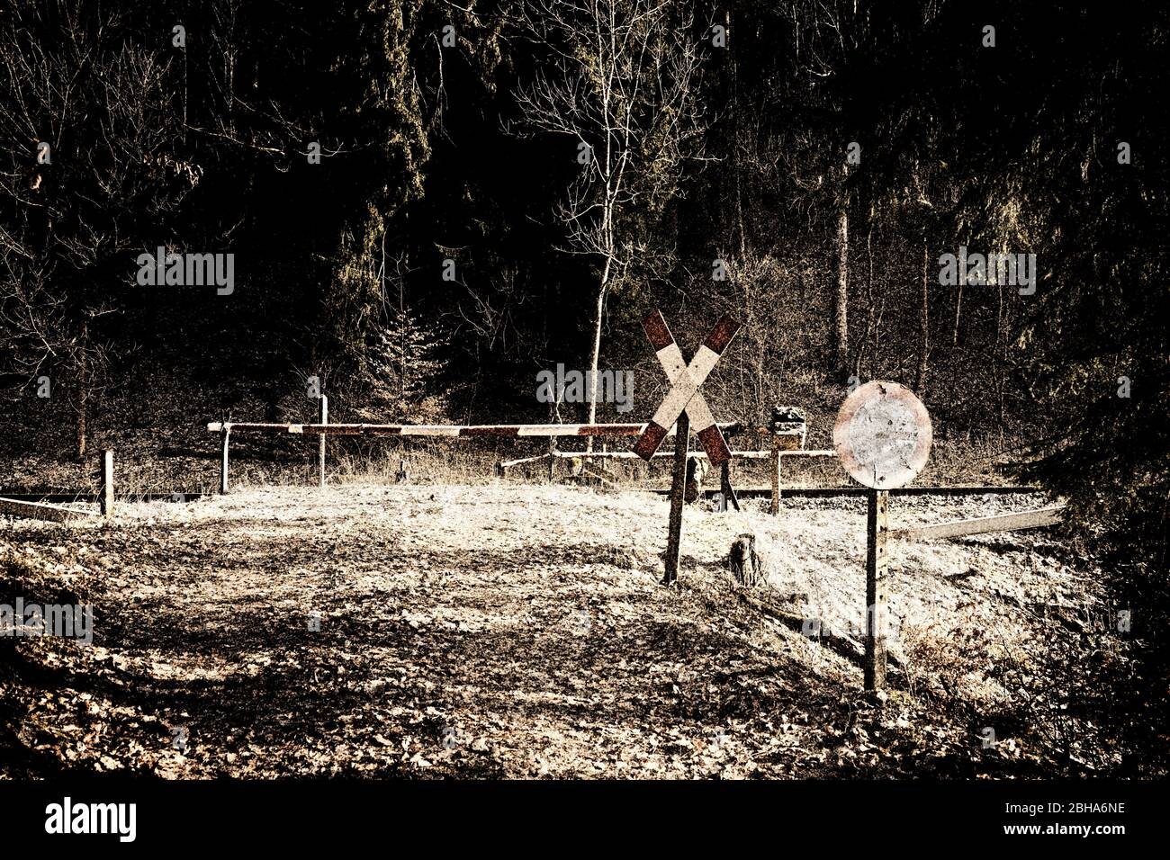 Railroad crossing, barrier out of service, desolate, St. Andrew's Cross, traffic sign closed for vehicles, digitally processed, RailArt Stock Photo