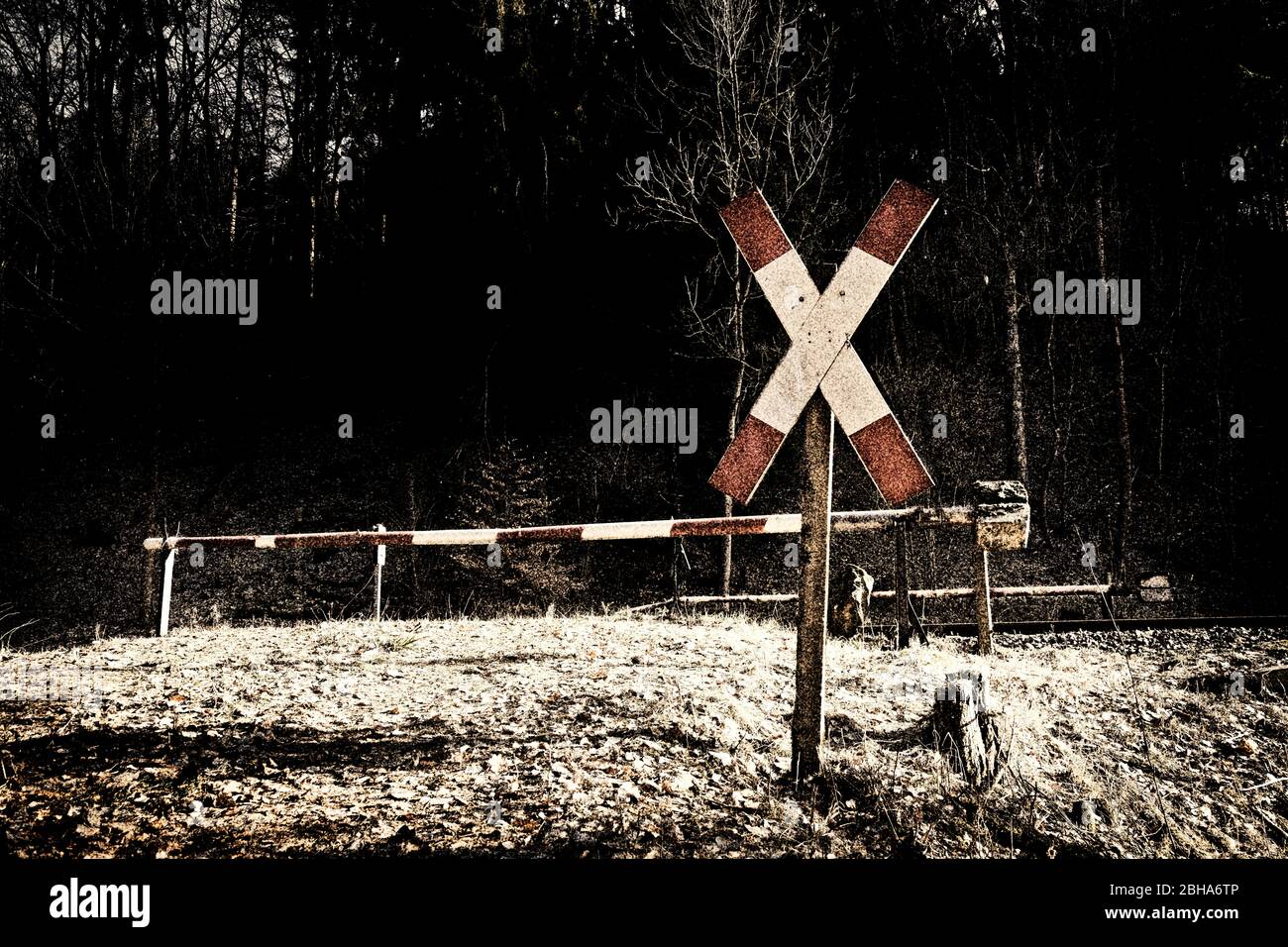 Railroad crossing, barrier out of service, desolate, St. Andrew's Cross, digitally processed, RailArt Stock Photo