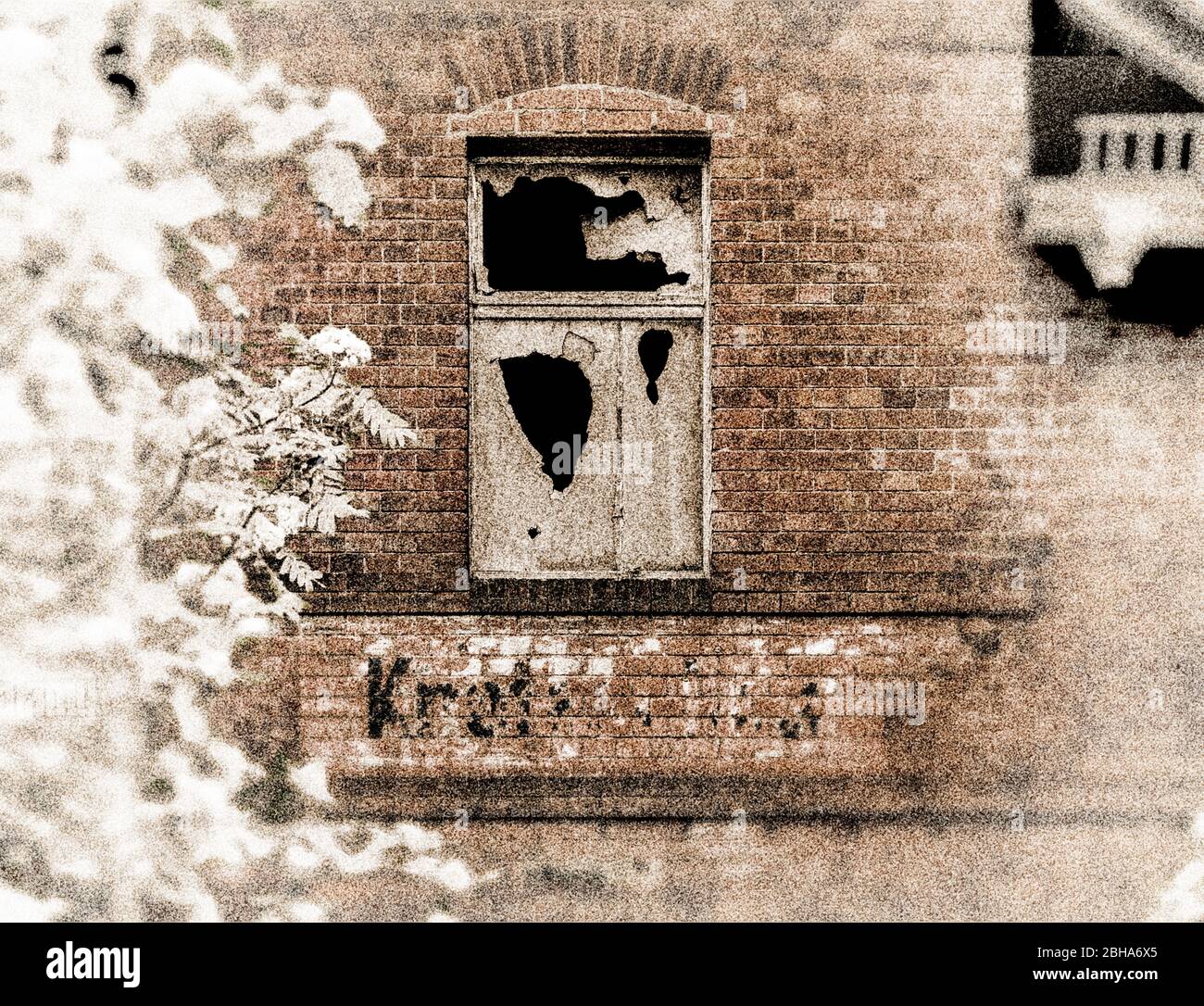 Window, slices cracked, replaced against press board, thrown in, wall, station name weathered, bricks, branches, digitally processed, RailArt Stock Photo