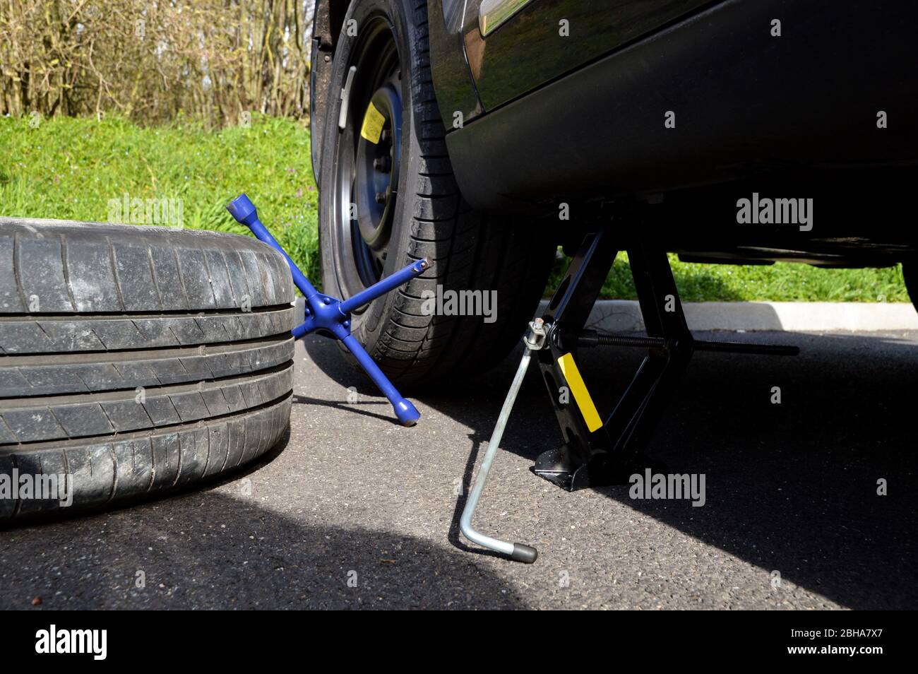 A spare tire and lug wrench and jack, following a tire puncture Stock