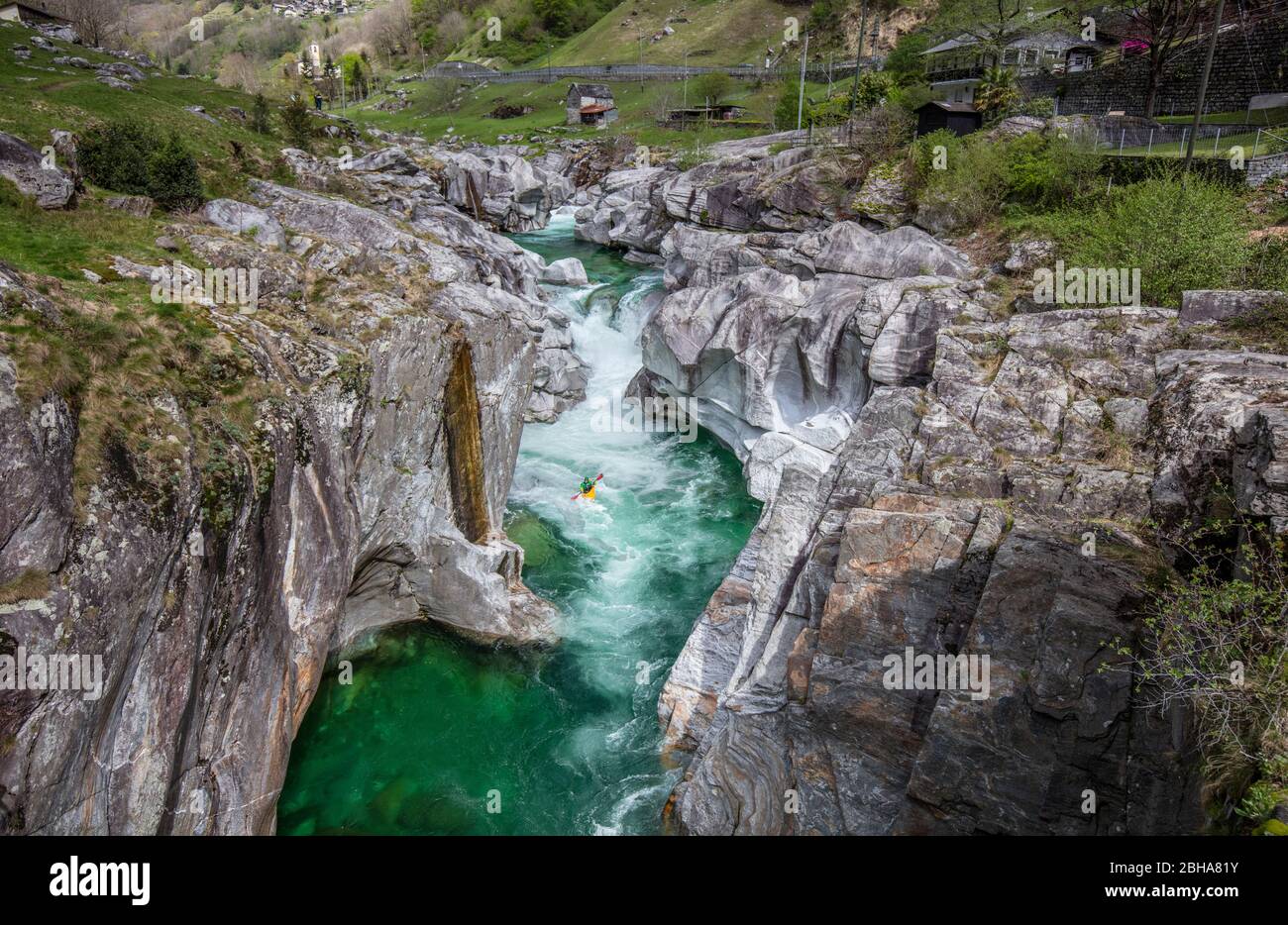 Switzerland, Alps, Ticino, Locarno, Verzasca Valley, Verzasca, canoe, canoeists, green water, whitewater, rapids, high smooth rocks Stock Photo