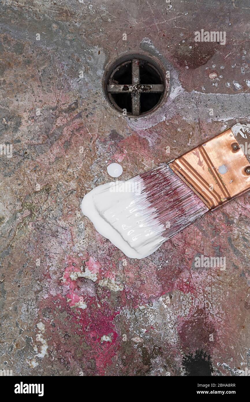 Wet messy paint brush in dirty sink Stock Photo