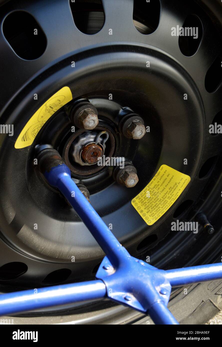 A spare tire and lug wrench, following a tire puncture Stock Photo Alamy