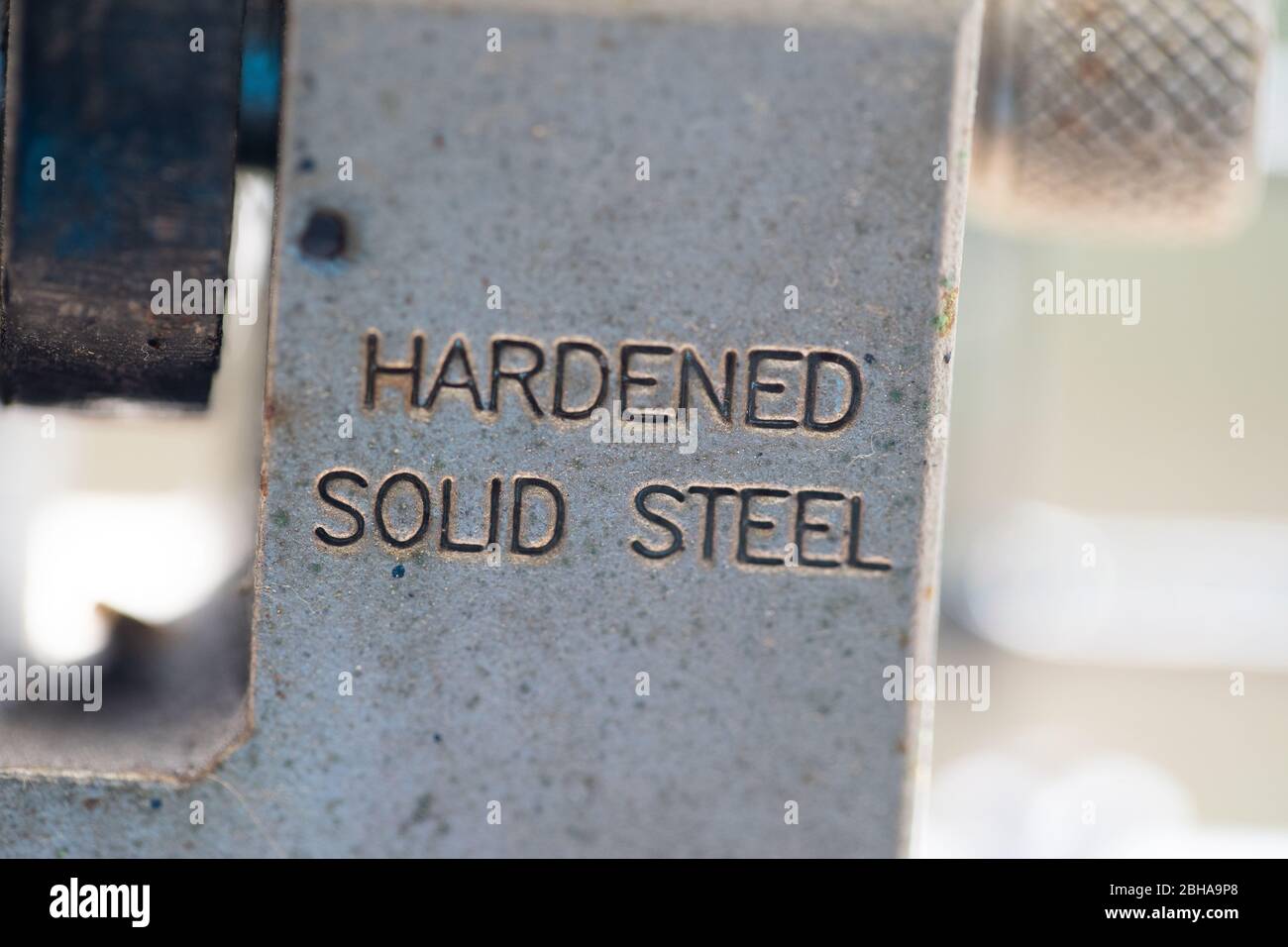detail of steel padlock with the inscription 'hardened solid steel' Stock Photo
