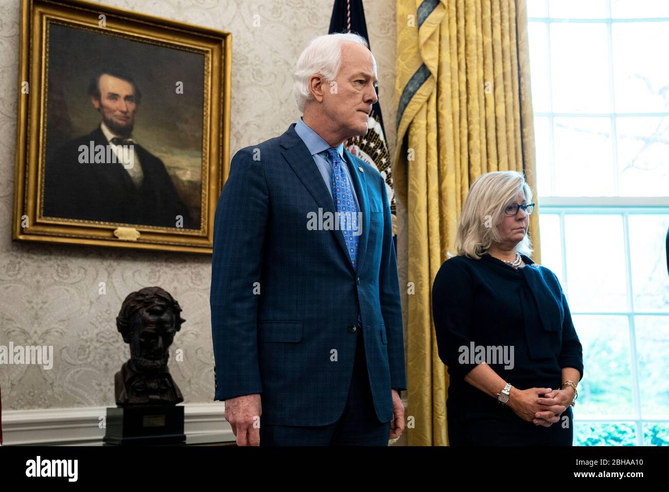 From left to right: United States Senator John Cornyn (Republican of Texas) and US Representative Liz Cheney (Republican of Wyoming) stand behind US President Donald J. Trump at a signing ceremony for H.R.266, the Paycheck Protection Program and Health Care Enhancement Act, in the Oval Office of the White House in Washington DC on April 24th, 2020.Credit: Anna Moneymaker/Pool via CNP/MediaPunch Stock Photo