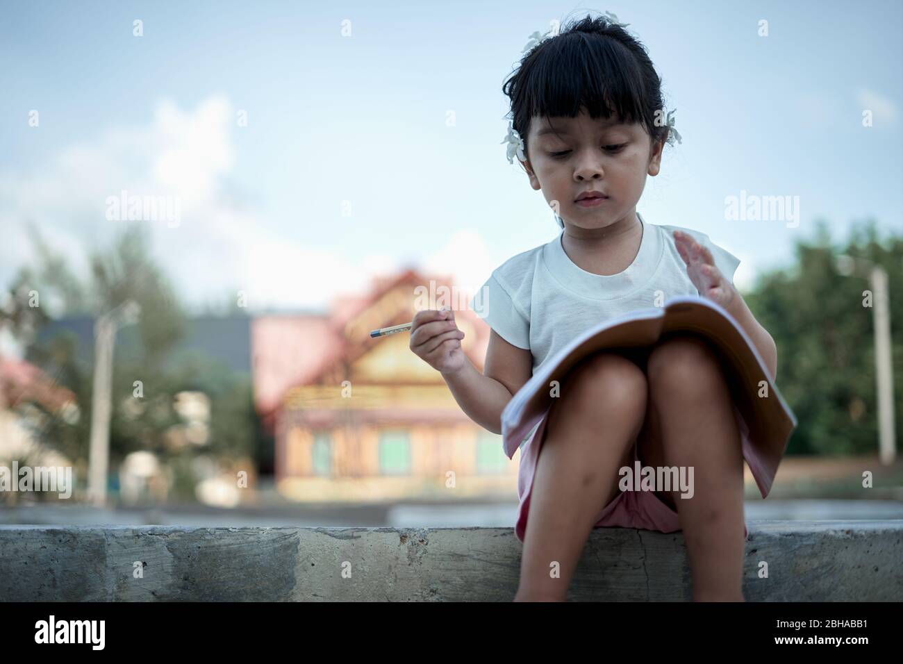 Asian little girl study from home during a virus  outbreak Stock Photo