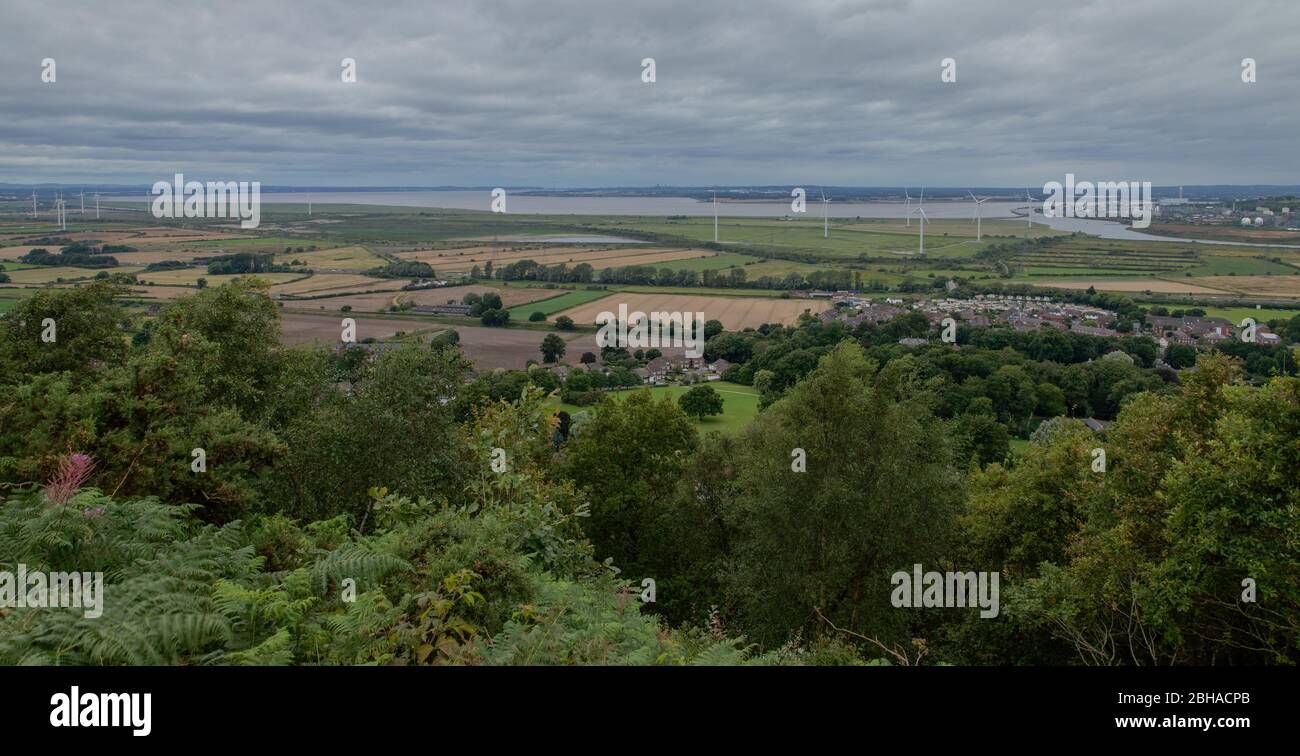 View across Frodsham Marsh owards south Liverpool and the Wirral from Overton Hill near Frodsham in Cheshire, along the Sandstone Trail Stock Photo