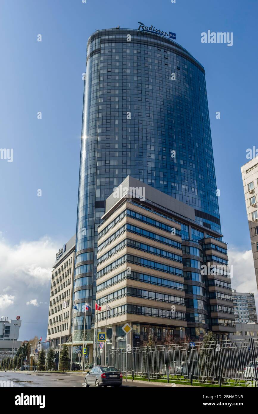 Moscow, Russia - April 22, 2020: glass facade of a high-rise building Radisson Blu Olympiyskiy Hotel. Stock Photo