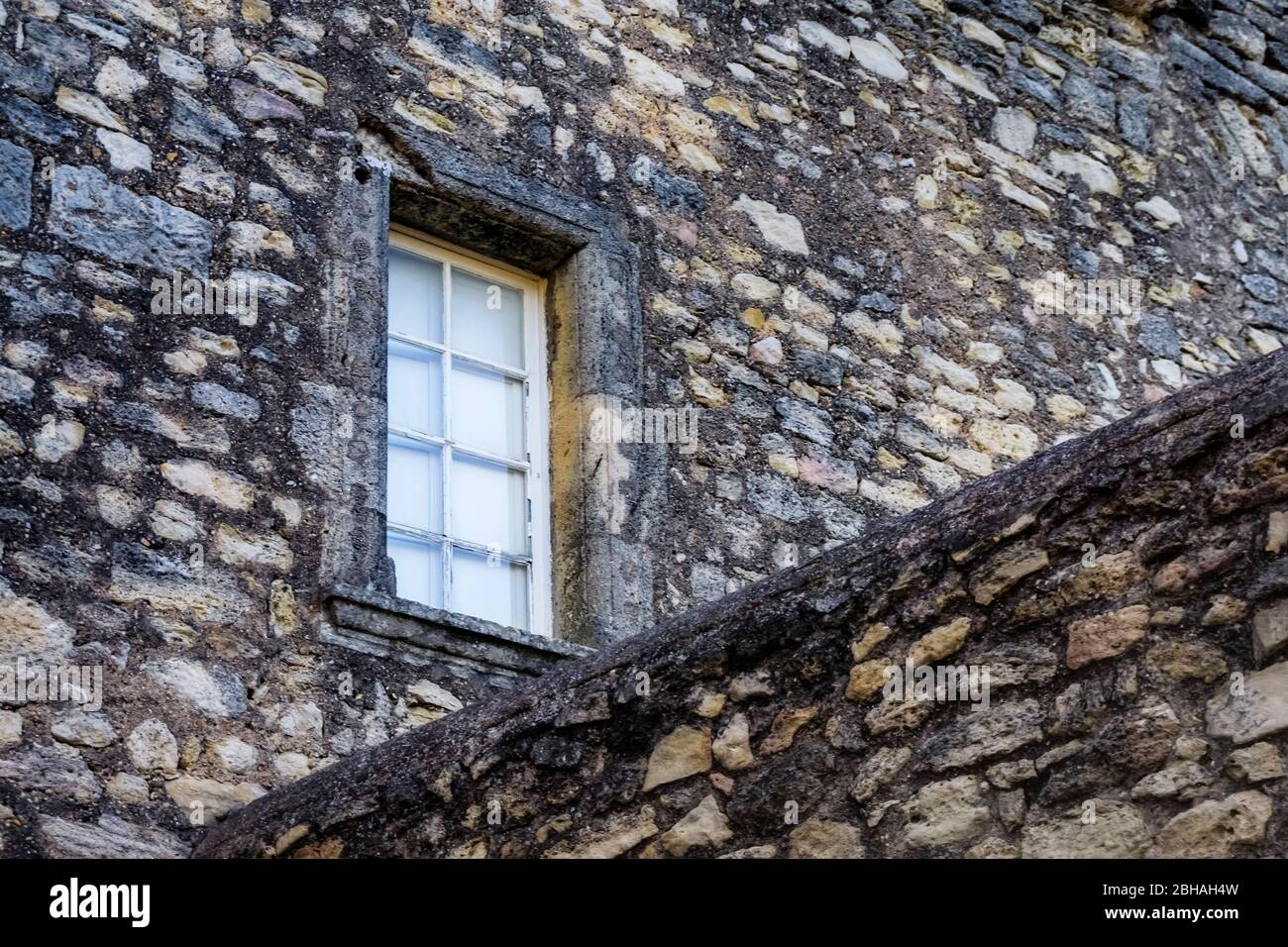 Window in the Château de Maureilhan. Old castle complex, construction begins in the XIV century. Monument Historique. Stock Photo