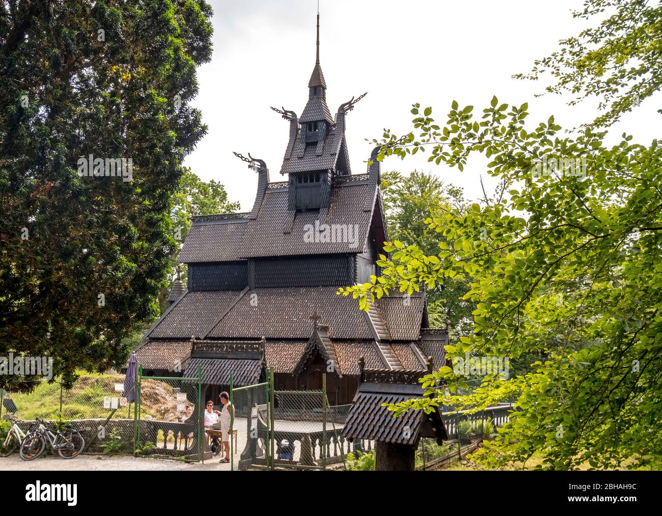 Tourists in front of the stave church Fantoft, Fantoftvegen Paradis, Hordaland, Norway, Scandinavia, Europe Stock Photo
