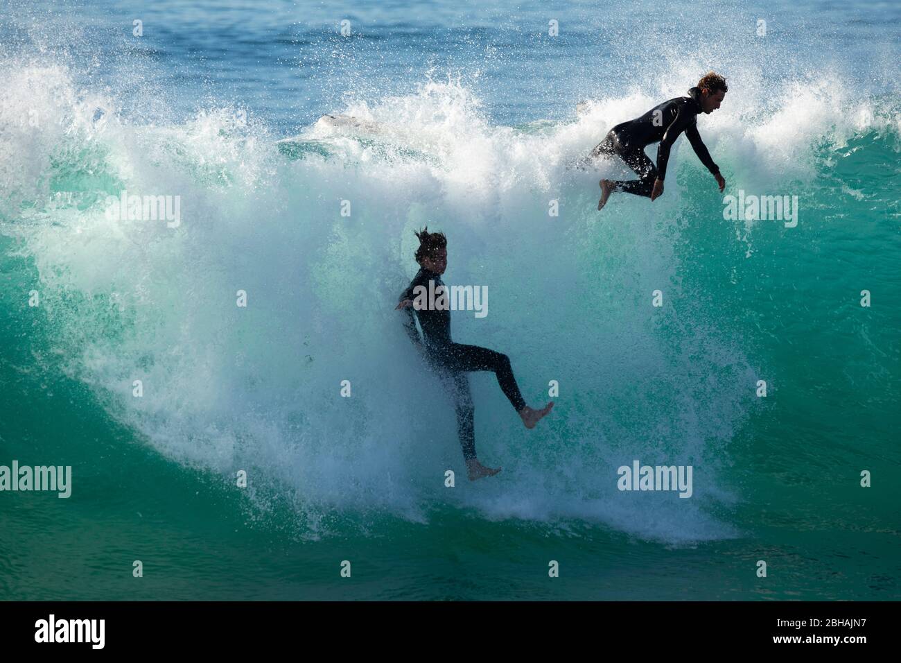 Surfers in sea, Huntington Beach, California, USA Stock Photo