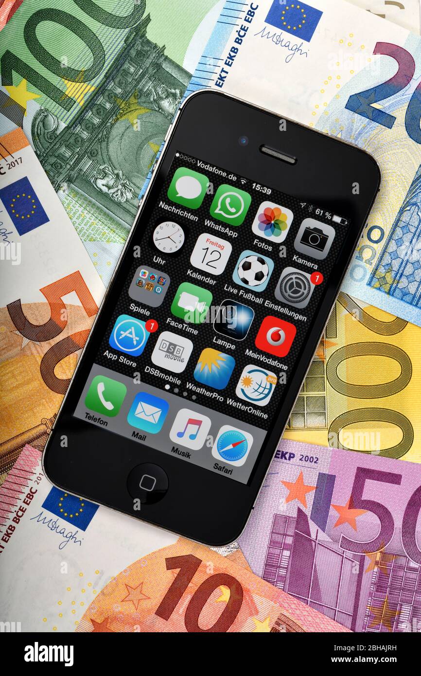 Icon image Shopping by mobile phone, smartphone is on EURO banknotes Stock Photo