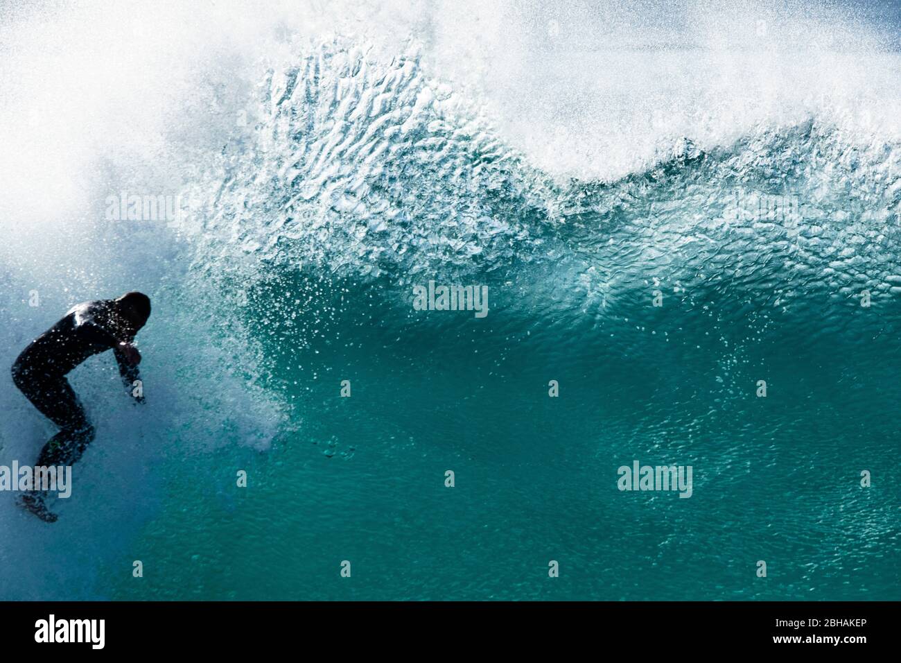 Surfer in wetsuit in sea, Huntington Beach, California, USA Stock Photo