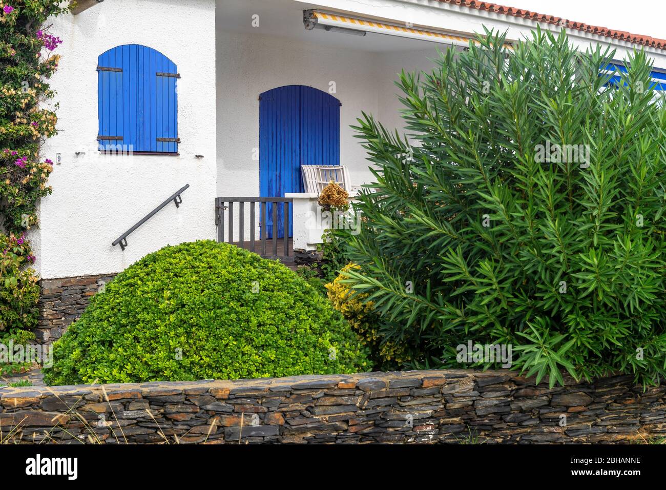Europe, Spain, Catalonia, Costa Brava, Port de la Selva, Mediterranean house with blue shutters just outside the coastal town of Port de la Selva Stock Photo