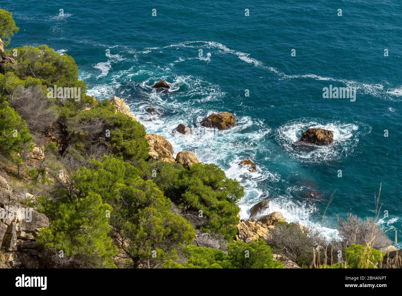 Europe, Spain, Catalonia, Costa Brava, looking down on the surf on the Costa Brava between Cadaqués and Roses Stock Photo