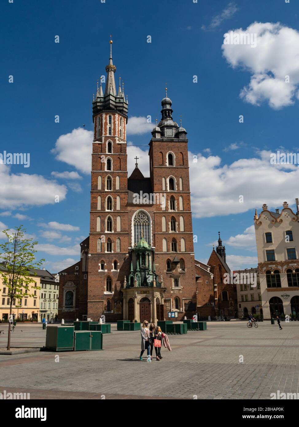 Cracow/Poland - 22/04/2020. Almost empty Main Square in Krakow during coronavirus covid-19 pandemic.  View over Mariacki Church. Stock Photo