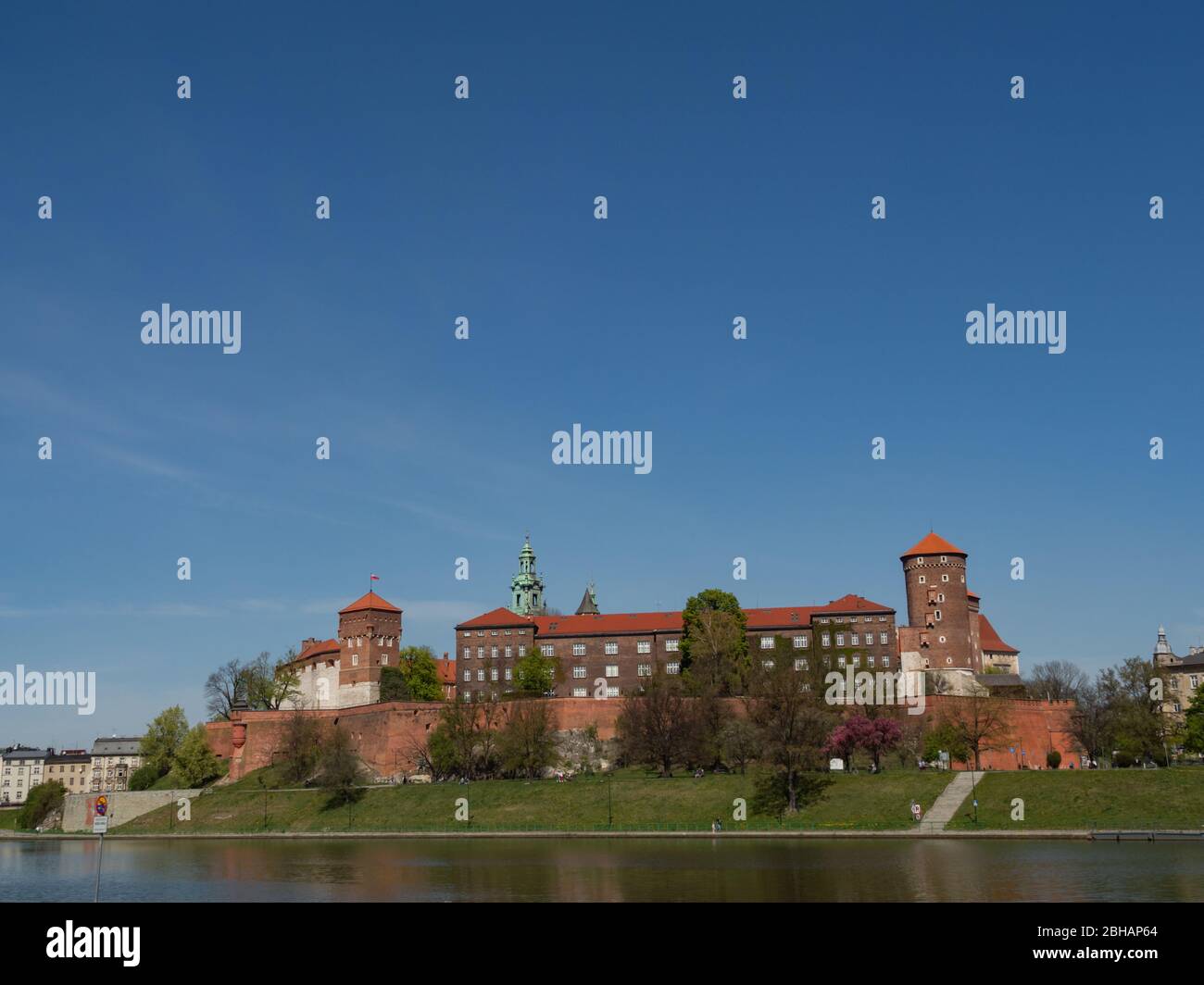 The former Royal residence of Polish monarchy, Wawel Castle, Krakow, Poland. Spring time, view from the Vistula river boulevard.  Negative space fora Stock Photo