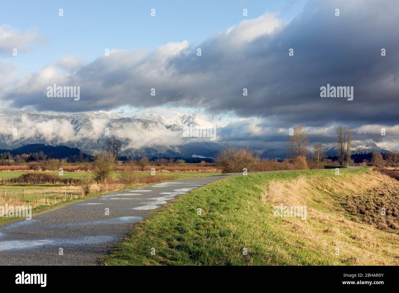 Beautiful view from historic Pitt Meadows - Maple Ridge Dykes in Greater Vancouver area, British Columbia, Canada. Stock Photo