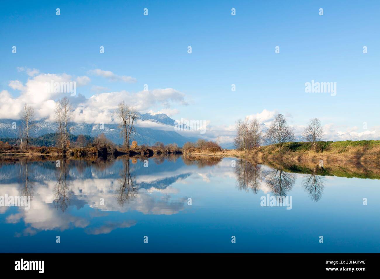 Beautiful view from historic Pitt Meadows - Maple Ridge Dykes in Greater Vancouver area, British Columbia, Canada. Stock Photo