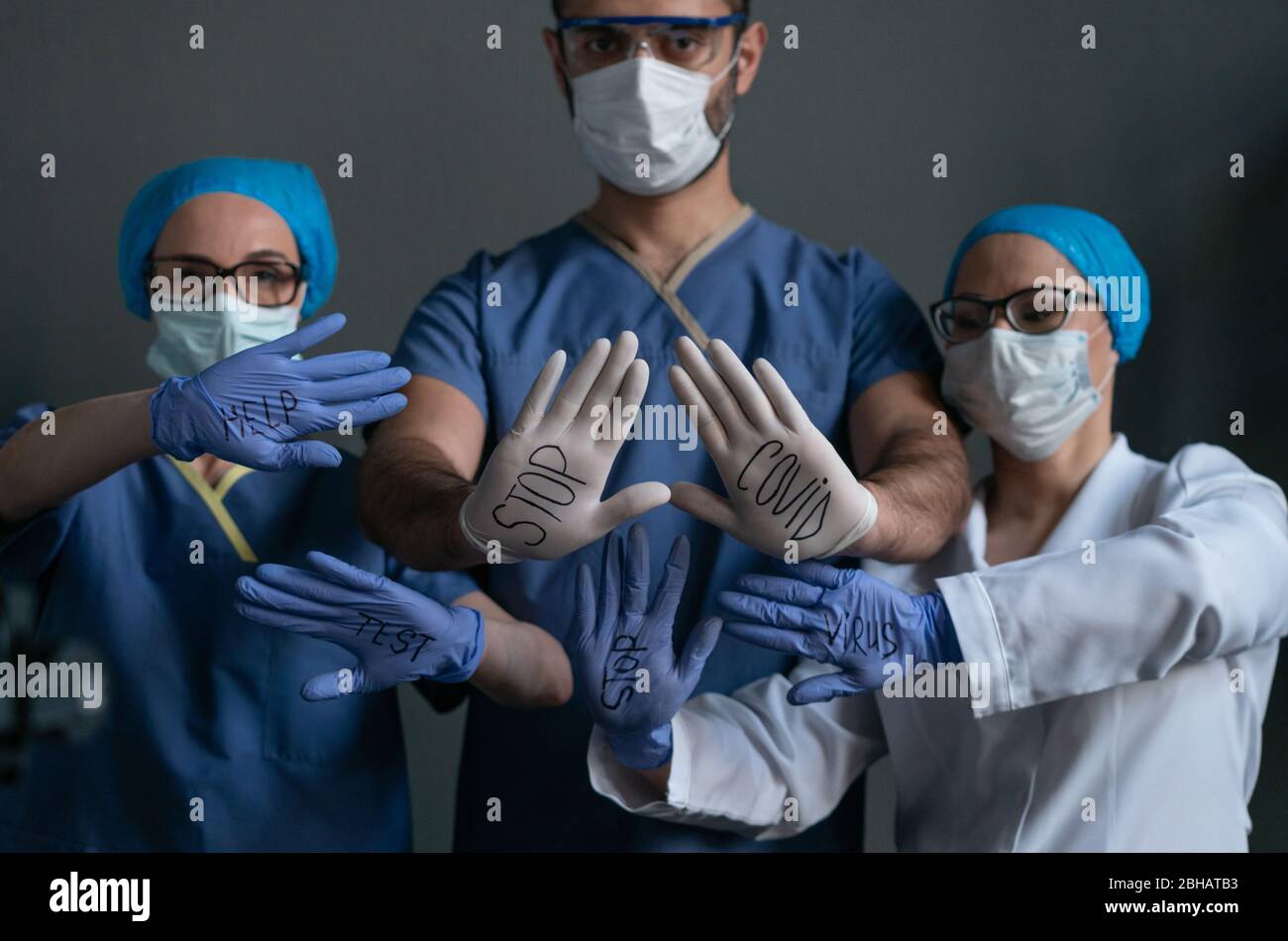 Doctors With Inscriptions On Disposable Gloves Stock Photo