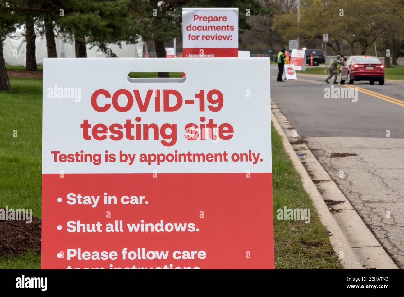 Dearborn, Michigan, USA. 24th Apr, 2020. Drive-though testing for the Covid-19 virus at a CVS Pharmacy test site. The site promises results in 15 minutes. Credit: Jim West/Alamy Live News Stock Photo
