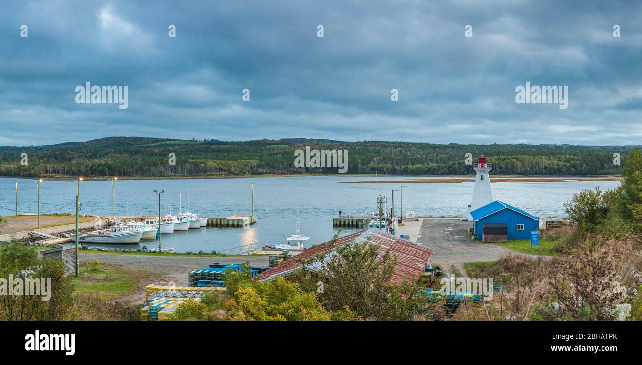 Canada, Nova Scotia, Mabou, Mabou Harbour and Lighthouse, elevated view, dusk Stock Photo