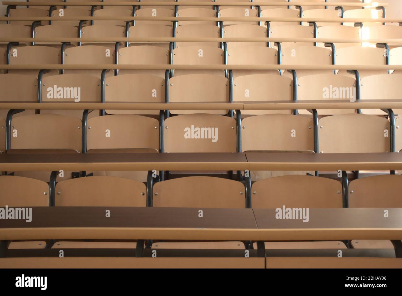 Shot of well organized empty university classroom seats due to the global pandemic after the cancellation of schools Stock Photo