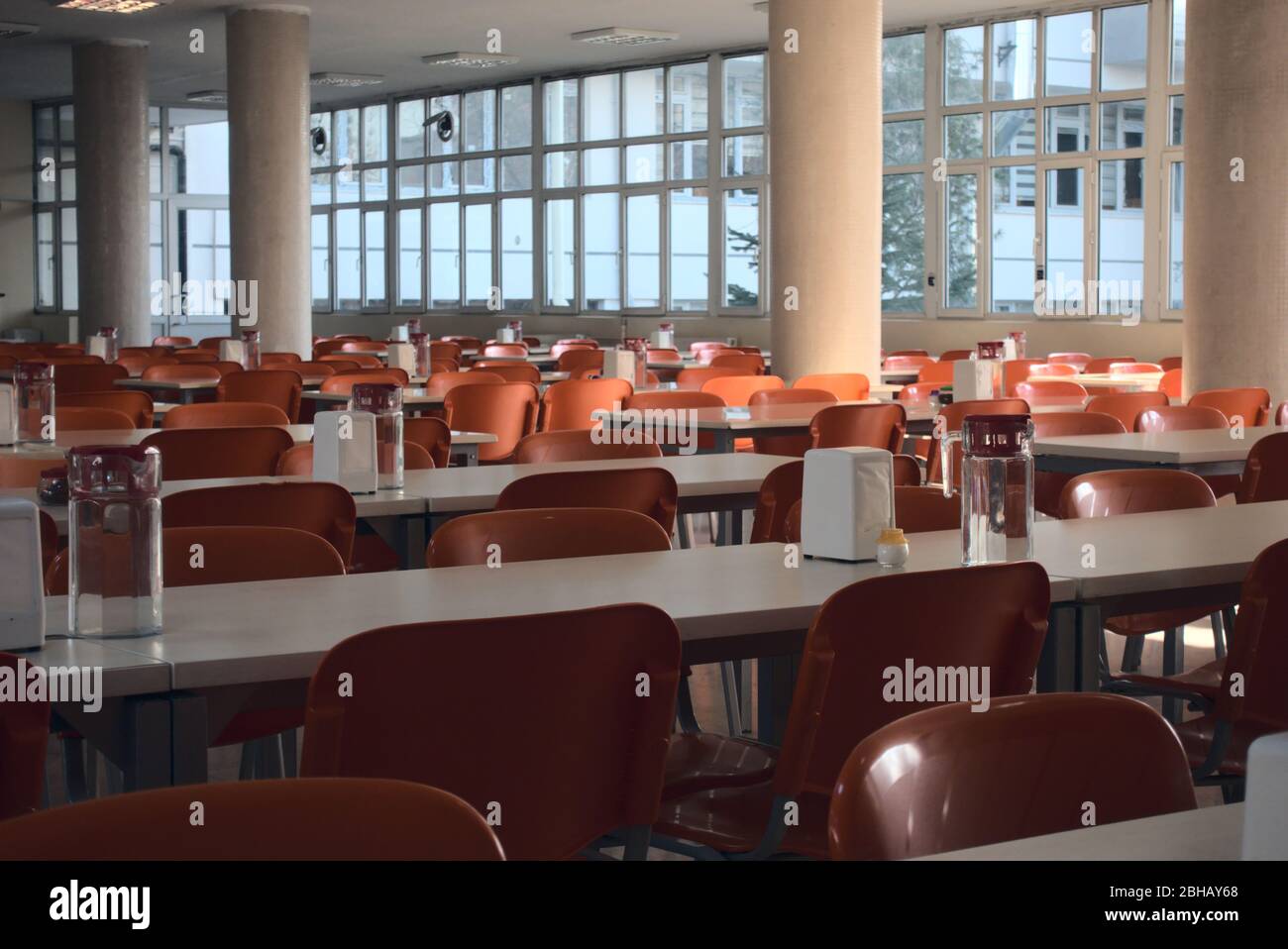 Empty university cafeteria seats after the cancellation of schools regarding covid 19 Stock Photo