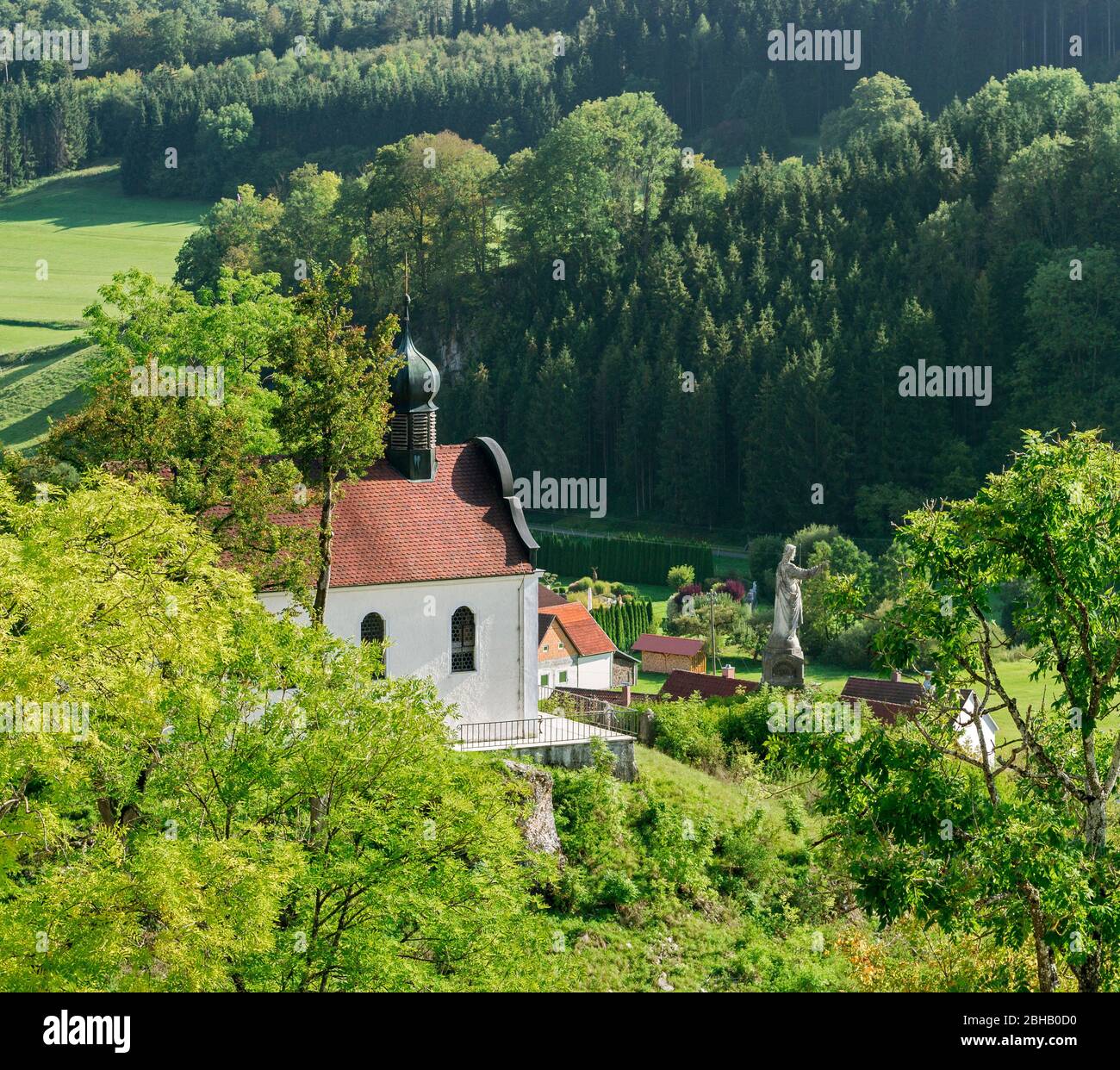 Germany, Baden-Württemberg, Schelklingen - Huts, view from the castle rock on the 1717/19 built 'Chapel to the painful Mother of God' with the statue of the 'Good Shepherd' Stock Photo