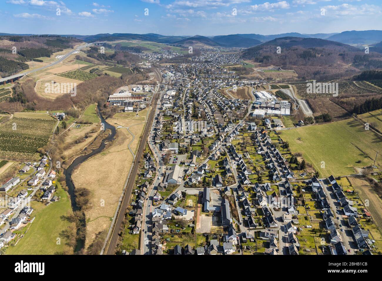 Aerial view with M. Busch GmbH & Co. KG in the Ruhr Valley and view of Bestwig in the Sauerland, North Rhine-Westphalia, Germany Stock Photo