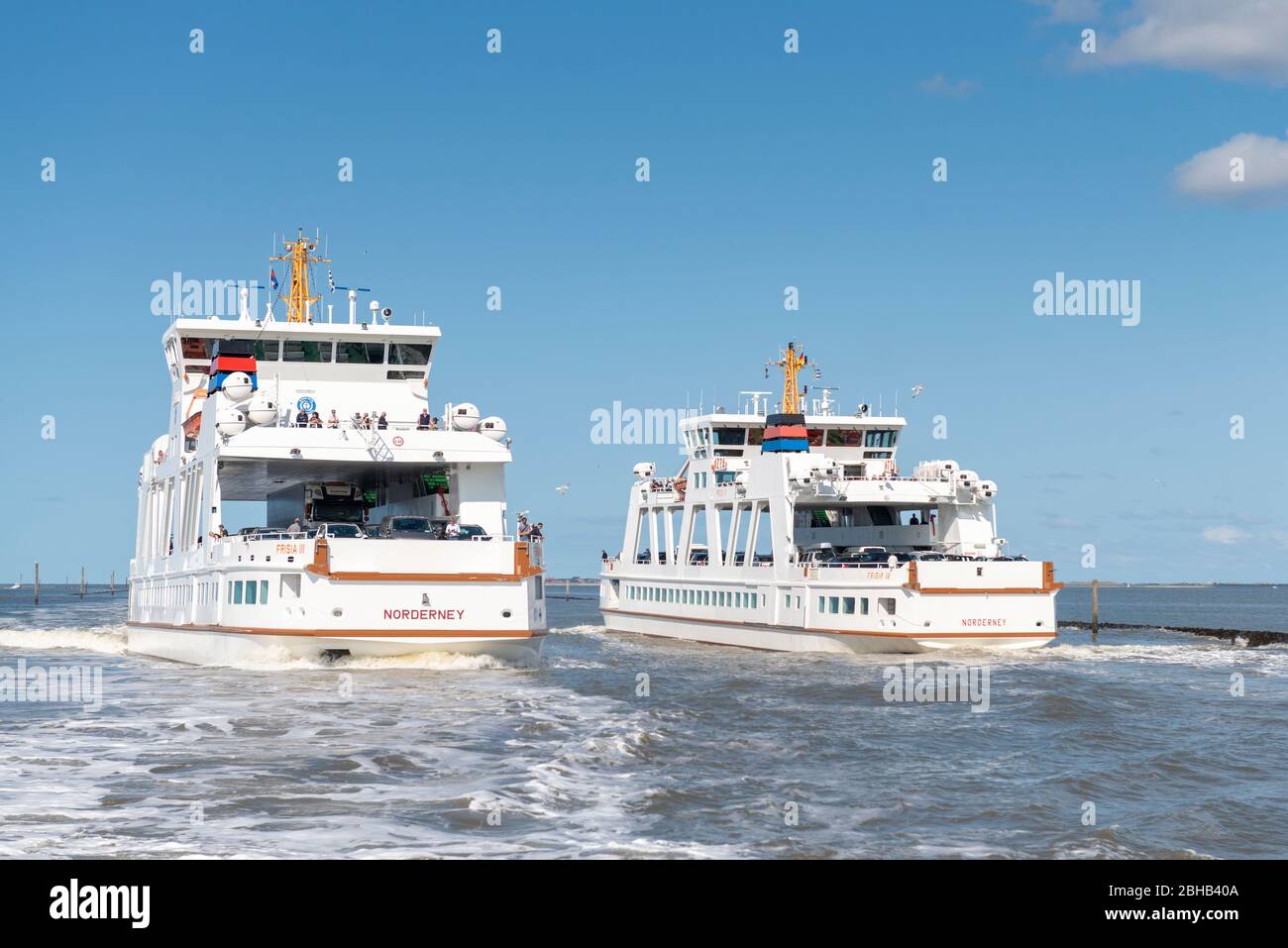 Germany, Lower Saxony, Ostfriesland, Norderney, the Norderneyfähre at the harbor exit of Norddeich. Stock Photo