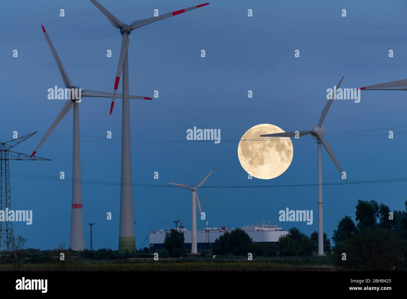 Germany, Ostfriesland Wind turbines near Emden with full moon. [M] Stock Photo