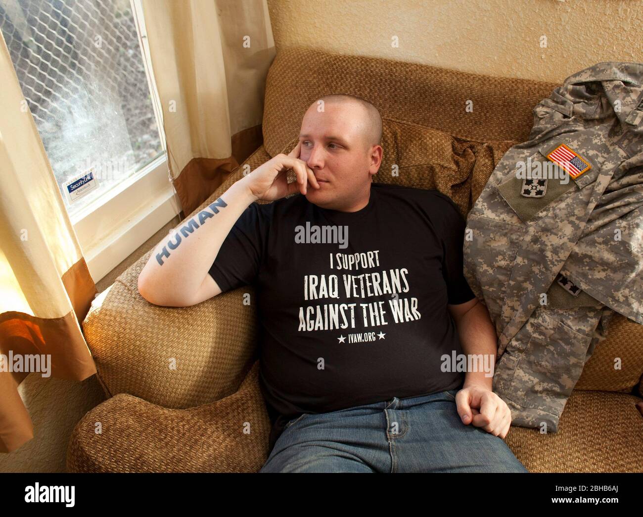 Killeen Texas USA, March 31 2010: Iraq War veteran Michael Kern, head of the group Iraq Veterans Against the War (IVAW) in the Under the Hood 'peace house' outside the sprawling Fort Hood Army base in central Texas. Kern, who suffers from Post Traumatic Stress Disorder (PTSD), is trying to obtain a medical discharge from the Army.   ©Bob Daemmrich Stock Photo
