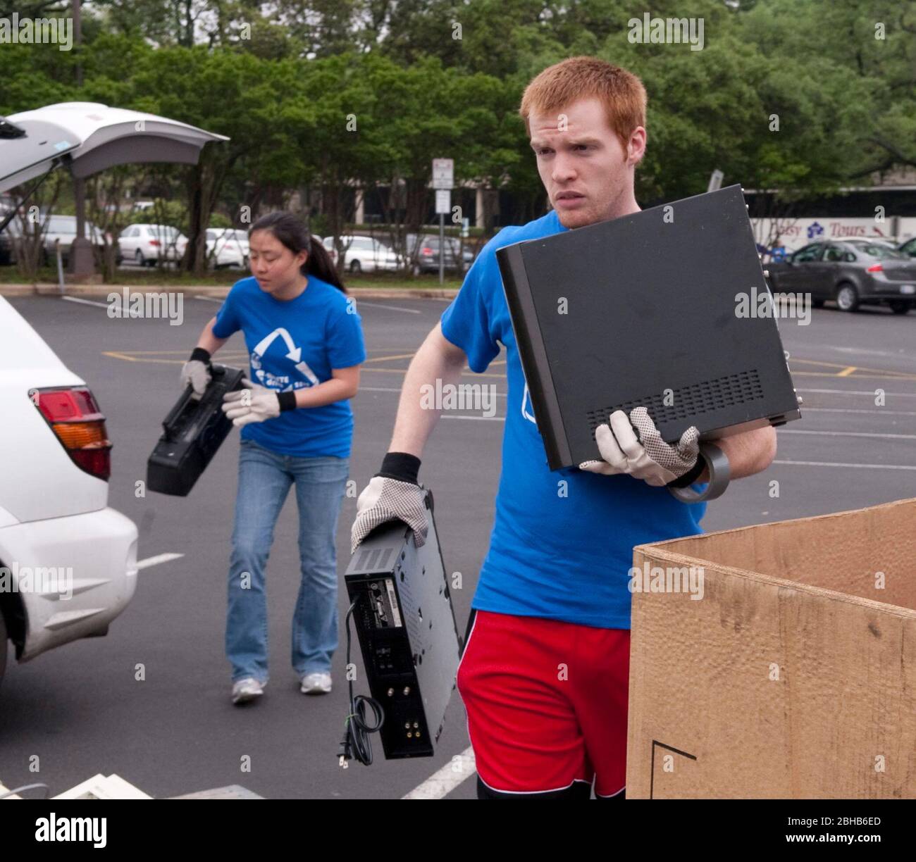 Austin Texas USA, April 17 2010: Engineering students from the University of Texas coordinate an 'E-Waste Drive' to recycle old computers and electronics from households and offices to keep  hazardous materials out of local landfills. About 50 stacks of computers, monitors, printers and televisions were hauled away for proper disposal in the day-long effort. ©Bob Daemmrich Stock Photo