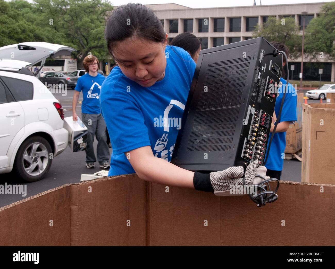 Austin Texas USA, April 17 2010: Engineering students from the University of Texas coordinate an 'E-Waste Drive' to recycle old computers and electronics from households and offices to keep  hazardous materials out of local landfills. About 50 stacks of computers, monitors, printers and televisions were hauled away for proper disposal in the day-long effort. ©Bob Daemmrich Stock Photo