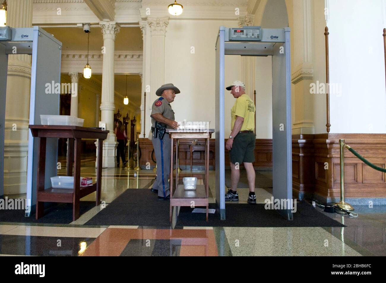 Austin Texas USA, May 21 2010: Beginning today new security measures are in place at the Texas Capitol. All visitors, including lobbyists, must now walk through metal detectors as they enter the building. Uniformed Department of Public Safety officers staff the detection stations at the Capitol's main entrance. ©Marjorie Kamys Cotera/Daemmrich Photography Stock Photo