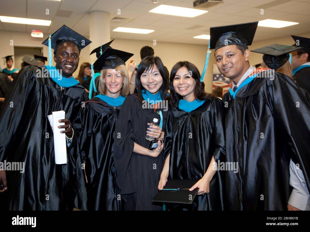 Austin Texas USA, May 22, 2010: Students pose for a photo during graduation festivities at the Lyndon Baines Johnson (LBJ) School of Public Affairs. Approximately 108 students received their Masters or PhD degrees in public policy studies through the school at the University of Texas at Austin. ©Bob Daemmrich Stock Photo