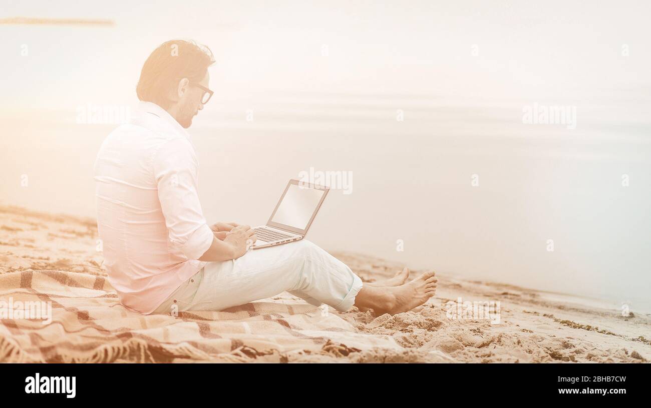 Freelancer on sea side work for concept design. Summer background. Business concept. Summer vacation concept Stock Photo