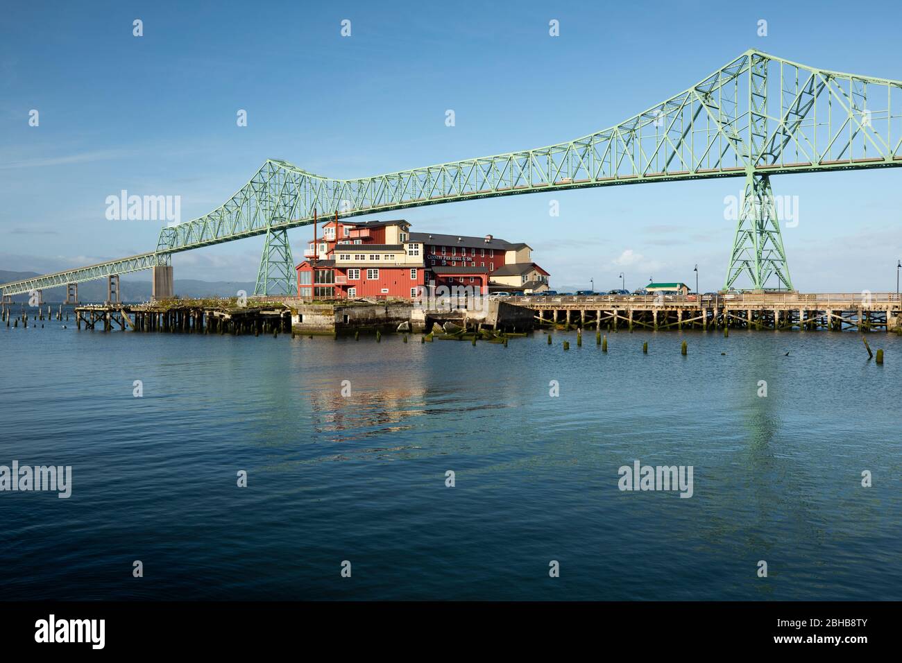 Low angle view of Astoria Bridge over river and building, Oregon, USA Stock Photo
