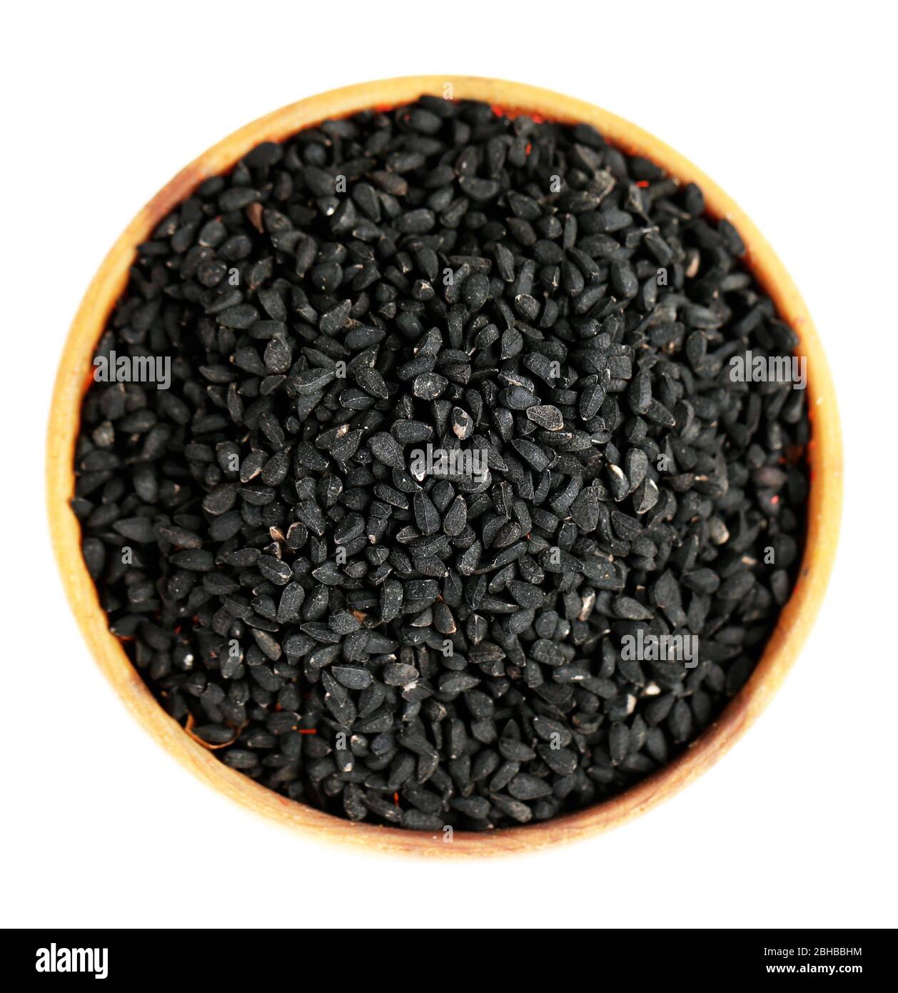 Black sesame in wooden bowl, isolated on white Stock Photo - Alamy