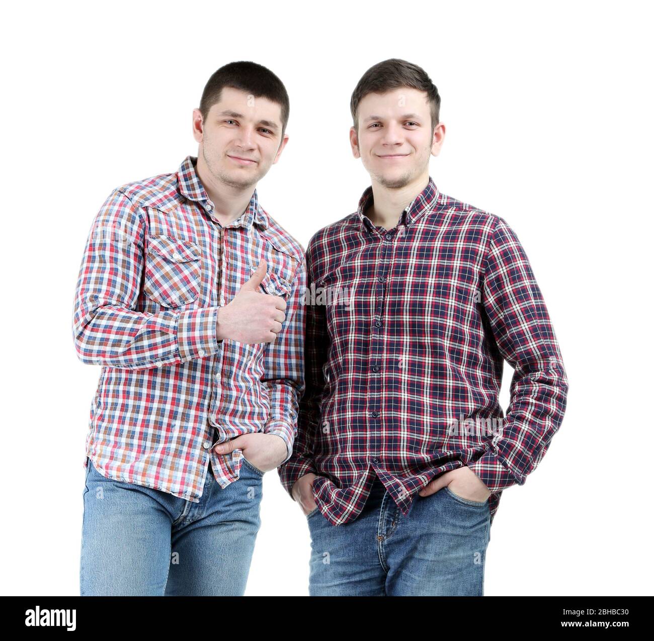 Two handsome young men isolated on white Stock Photo - Alamy