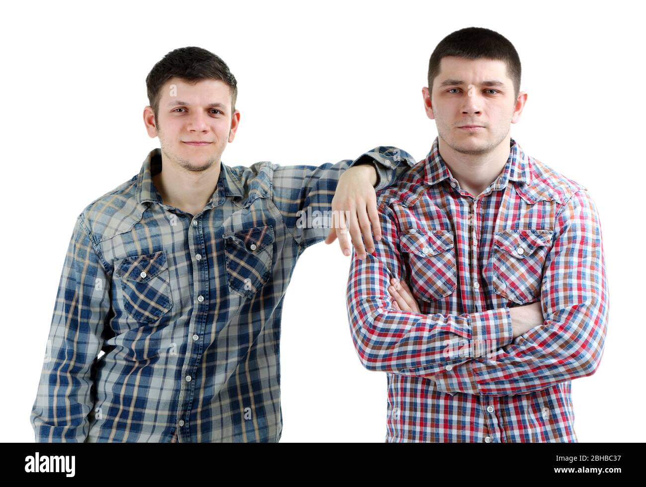 Two handsome young men isolated on white Stock Photo - Alamy