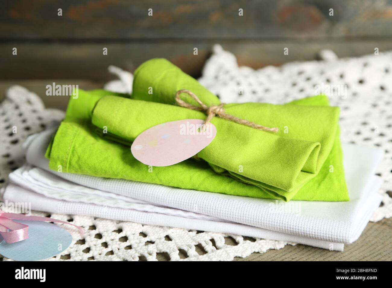 Napkins with Easter decorations  on wooden background Stock Photo